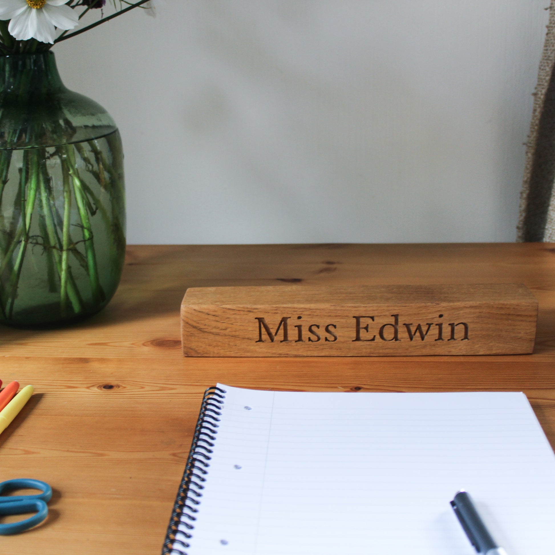 Teacher's desk with wooden name plaque