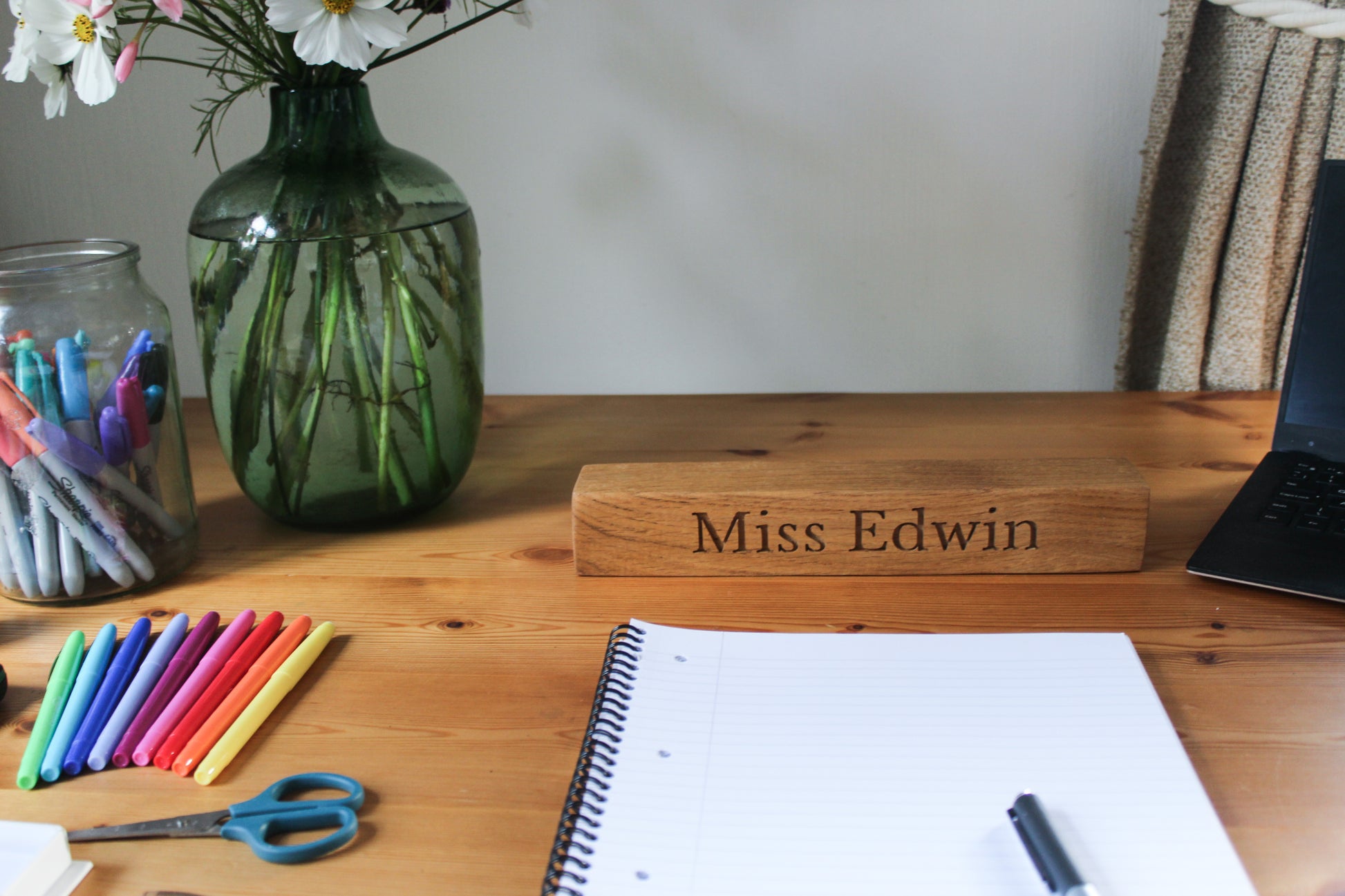 Teacher's desk with wooden name plaque