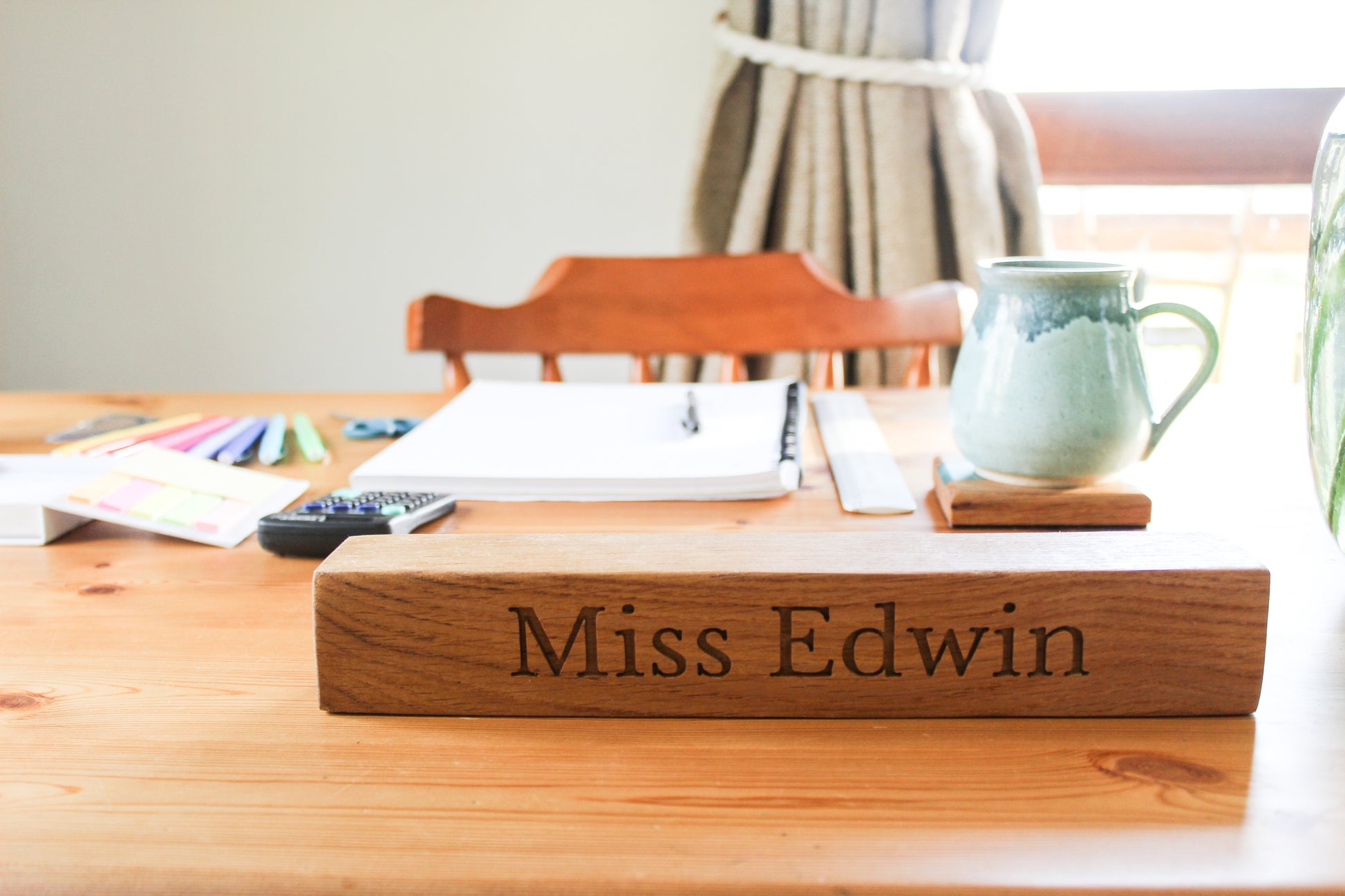 Teacher's desk with wooden name plaque