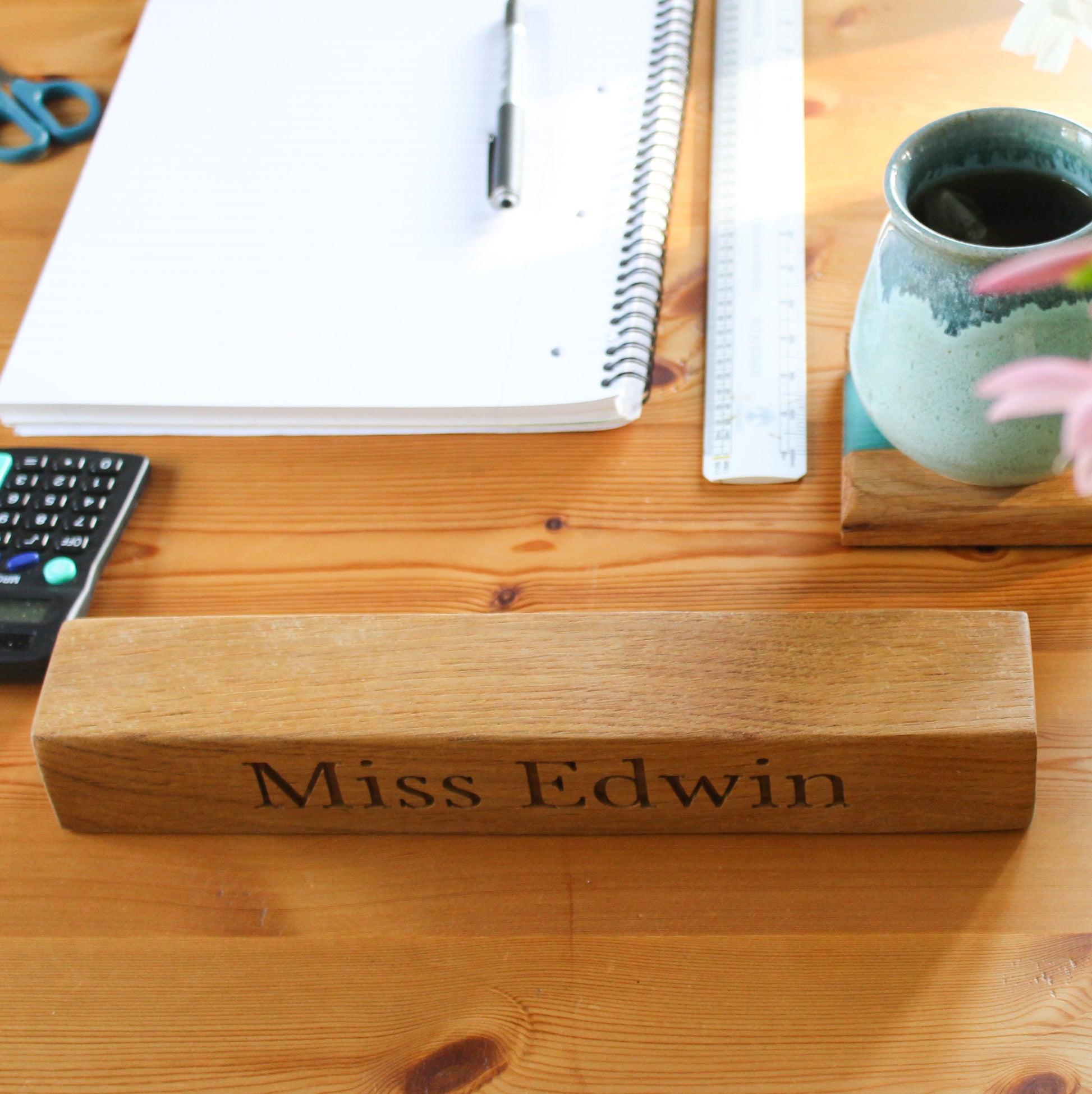 Teacher's desk with wooden name plaque